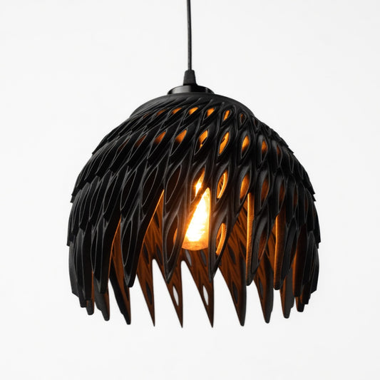 Black feather-like pendant light on a white background